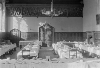General view of the dining hall at Trinity College, Glenalmond with the tables set for afternoon tea.