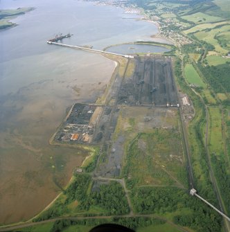 General oblique aerial view looking across the ore terminal towards Fairlie and Largs, taken from the S.