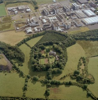 Oblique aerial view centred on the country house, with the chemical works adjacent, taken from the NE.