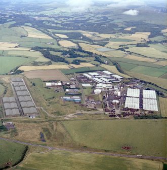 General oblique aerial view looking across the whisky distillery, taken from the WSW.