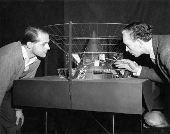 Festival of Britain, Exhibition of Industrial Power, Hall of the Future.
Victor Prus and J R Atkinson viewing the atomic energy display model.