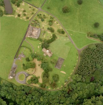 Oblique aerial view of Dunglass centred on the Collegiate Church with Dunglass House stables adjacent, taken from the ESE.