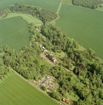 Oblique aerial view of Biel House, garden, gardener's cottage, bridge, dovecot, cottages and coach-houses, taken from the NW.