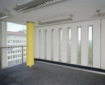 Interior. View showing slotted windows in open plan office