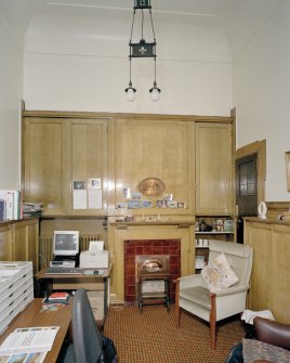 Interior. Chaplain's Office including original light fitting and fireplace