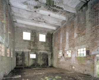 Interior. Double width Acetone Recovery House showing brickwork and ventilation area in E elevation and reinforced concrete roof beams.