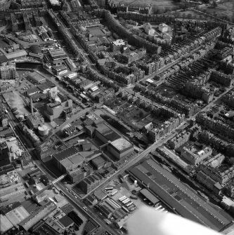 Oblique aerial view of Edinburgh centred on Fountainbridge, taken from the WNW.