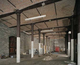 Interior. Ground floor showing double doors onto Camperdown Street on left of picture. The pile of rubble in the middle distance resulted from the excavations by structural engineers of the column base and where the ground and 1st floor meet.