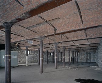 Interior.  1st floor. General view from SSE showing both rows of cast-iron columns.