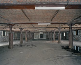 Interior.  3rd floor. General view from W showing cast-iron columns with paired double flanges. These flanges allowed the insertion of space dividers in order to store loose material like grain. The 2nd floor mirrors the 3rd floor.