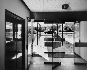 Interior.
View of research entrance and canopy from entrance hall of agricultural science building from interior.