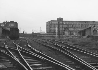 Scanned image of photograph showing view from SW looking to terminal buildings with Bonded Warehouse on Commercial Street in background.