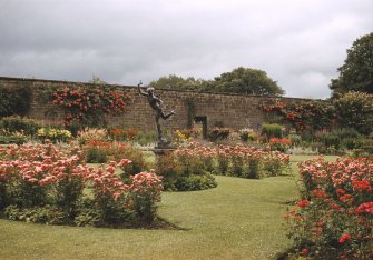 View of statue of Mercury in rose gardens.