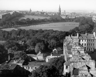 Photographic aerial view of part of George Square before redevelopment with Meadows and Bruntsfield in distance.
