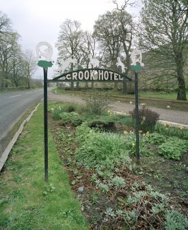 Detail of roadside 1930's 'Crook Hotel' sign to S attributed to Thomas Haddon and Company.