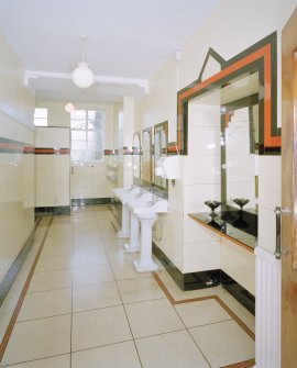 Interior.
Gentlemen's toilet, view from S showing original wash hand basins and 'Vitrolite' panels.