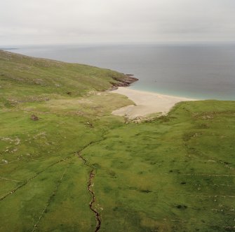 Mingulay, oblique aerial view centred on the remains of the township with the remains of the chapel house adjacent, taken from the SW.