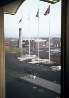 Glasgow Airport, Abbotsinch.
View of flags at entrance to terminal from under canopy.