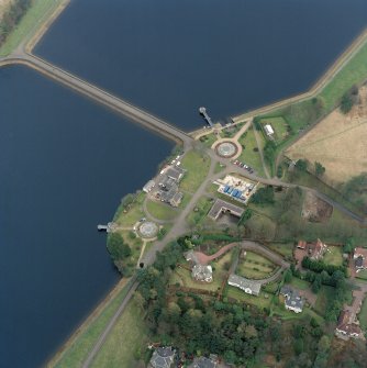 Scanned oblique aerial view of the junction between Mugdock (NS57NE.63) and Craigmaddie (NS57NE.61) Reservoirs including Mugdock Straining Well (NS57NE 63.05) and Chlorinating House (NS57NE 63.04)