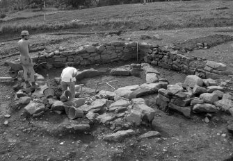 Excavation photographs: kiln house excavation in Area 7.