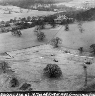 Wartime papers.
Oblique aerial view from SE showing camouflage test.