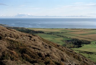 General view looking ENE from Silver Rock and showing the farm land  of Culmaily Farm (farmsteading in a clump of trees in the centre of the picture)