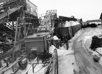 Scanned copy of view of processing plant and storage bins at West Pier