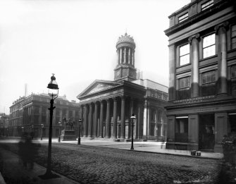 View of the Royal Exchange, the statue of Duke of Wellington and the Guardian Society Offices, Royal Exchange Square, Glasgow. The Royal Exchange now houses the Gallery of Modern Art.