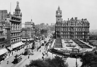 View from Scott Monument, Edinburgh looking east towards Calton Hill showing the North British Hotel, Waverley Gardens and a busy Princes Street with shop awnings, pedestrians, trams, buses and horse and carts.