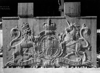Detail of carved coat-of-arms before being put in place above ceremonial entrance.