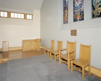 Interior. View of platform with communion table, elders chairs and font