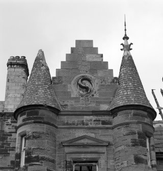 Detail of entrance tower turrets and roundel.