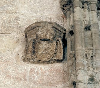 Detail of carved capital to left of monument with Bishop Kennedy's coat of arms, in St Salvator's College Church,  St Andrews.