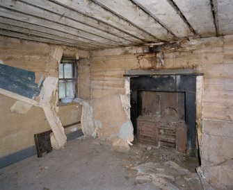 Interior. Kitchen showing fireplace and range