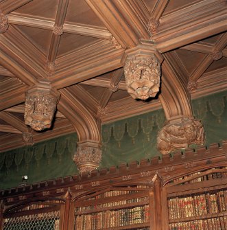 Library, interior, detail of carved wooden ceiling bosses.