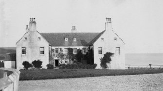 Digital copy of general view of main front of Balnakeil House from SW.
From photographic print pasted into A O Curle's 'Sutherland' journal (MS 36/9, page 86).