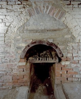 Interior. Ground floor. Kiln room. Kiln firebox. Detail showing repaired area dated '1942'.