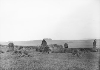 Circle at Chapel of Garioch, Inverurie (looking east). One high one (11ft) stands outside to the south. Diameter of circle 50ft. Altar stone 15x4ft. Stone to north has numerous cup-marks.