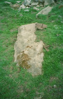 Jumper drill holes in the upper surface of the NW stone