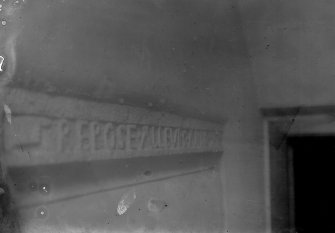 View of the engraved lintel over the original entrance doorway.