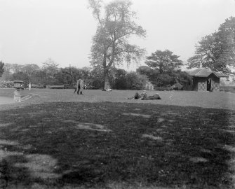 Edinburgh, Saughton Hall Park.
General view of visitors sitting on lawns in park.