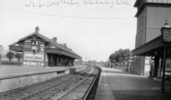 Kilwinning East Station: platform view entitled 'L.M.S. (Caledonian) Kilwinning East'.