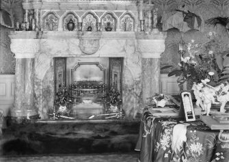 View of drawing room and marble fireplace with ornaments and possible bearskin rug, Montrave House.