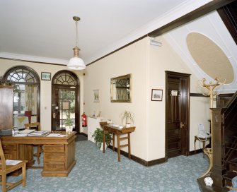 Interior. View of entrance hall showing glazed screen
