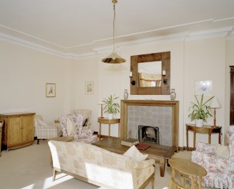 Interior. View of drawing room showing fireplace