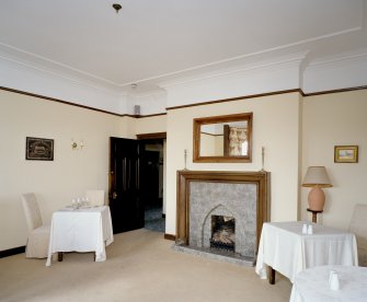 Interior. View of dining room including fireplace