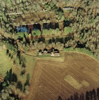 Oblique aerial view centred on the dairy, taken from the S.