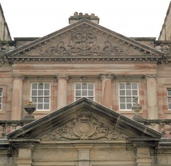 Detail of pediments on N front and above N doorway