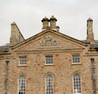 Detail of pediment on S front showing coat of arms
