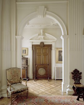 Ground floor hall of Arniston House, Midlothian, centred on arch and doorway in NE corner